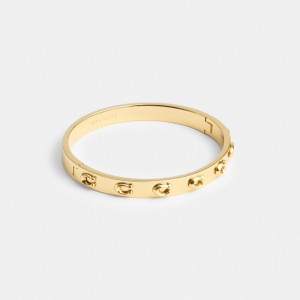 Gold Coach Pegged Signature Hinged Bangle | COH866190