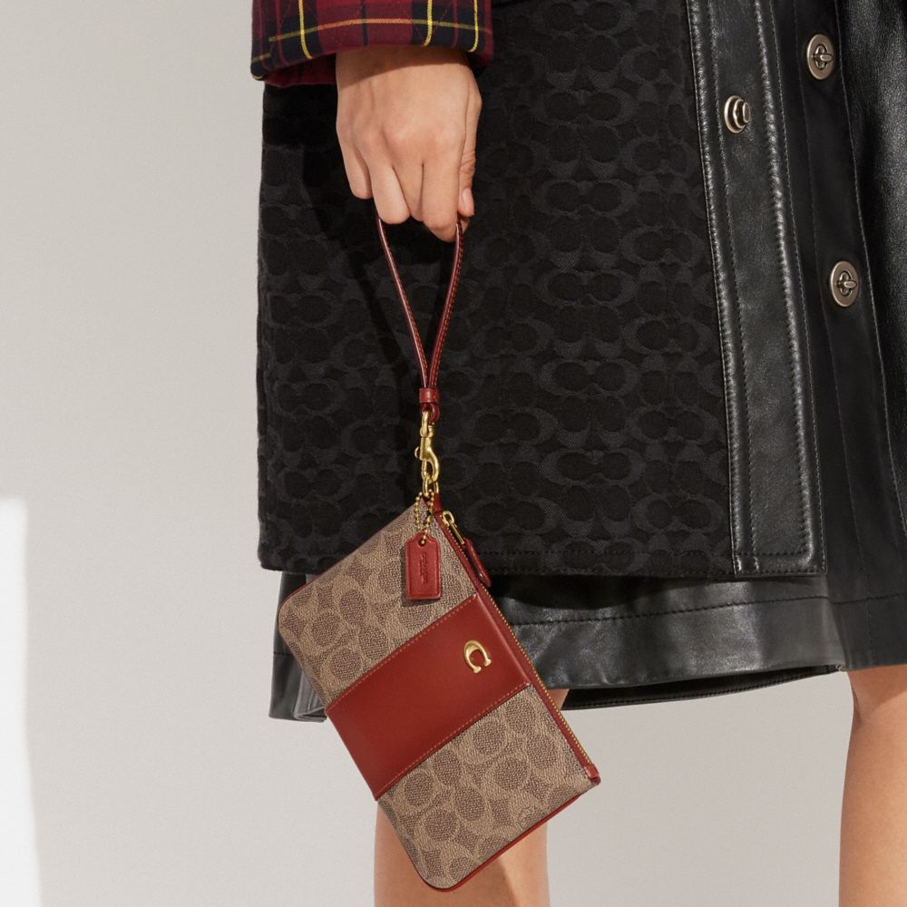 Coated Canvas/Brass/Tan/Rust Coach Small Wristlet In Signature Canvas | COH865645